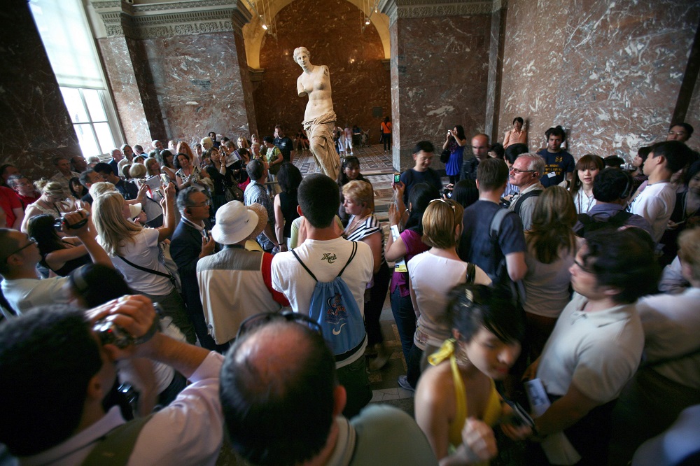 In this file photo taken on June 17, 2009 tourists look at the u00e2u20acu02dcVenus de Milou00e2u20acu2122 sculpture as they visit the Louvre museum in Paris. u00e2u20acu201d AFP pic      