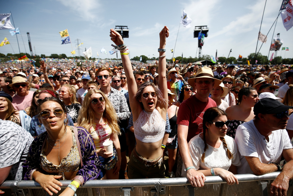 Festival goers watch British singer Tom Odell perform on the Pyramid Stage during Glastonbury Festival in Somerset, Britain June 28, 2019. u00e2u20acu201d Reuters picn