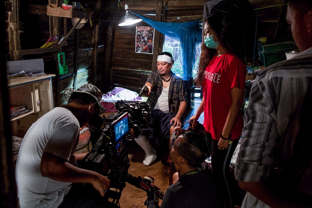 This photo taken on December 20, 2018 shows an actor performing a scene during filming for a movie in Yangon. u00e2u20acu201d AFP pic  
