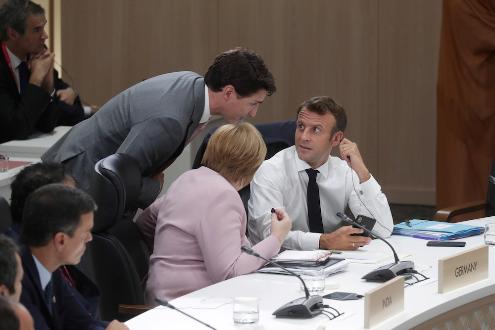 Canadau00e2u20acu2122s Prime Minister Justin Trudeau talks with Franceu00e2u20acu2122s President Emmanuel Macron and Germanyu00e2u20acu2122s Chancellor Angela Merkel during the closing session of G20 leaders summit in Osaka, Japan, June 29, 2019. u00e2u20acu2022 Reuters pic