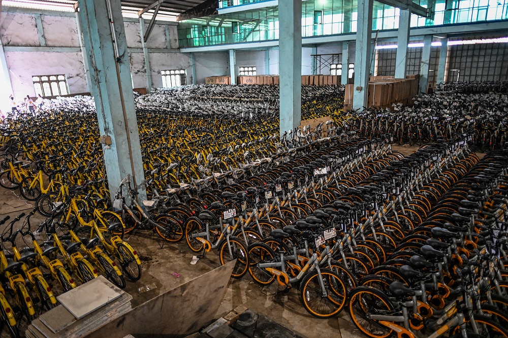In this picture taken on June 15, 2019, bicycles previously used in bike-sharing companies, which were shipped from Singapore as part of the u00e2u20acu02dcLesswalku00e2u20acu2122 scheme, are stored in a warehouse in Yangon. u00e2u20acu201d AFP pic       