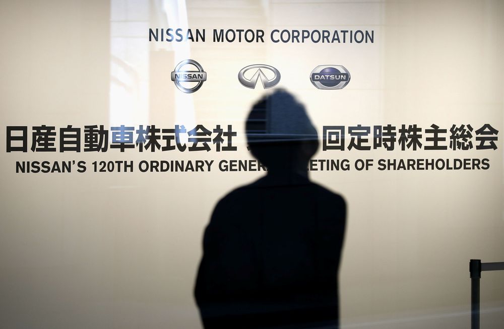 A man is seen in front of the signboard for the ordinary shareholders meeting of Nissan Motor Co in Yokohama, Japan, June 25, 2019. u00e2u20acu201d Kyodo picture via Reuters