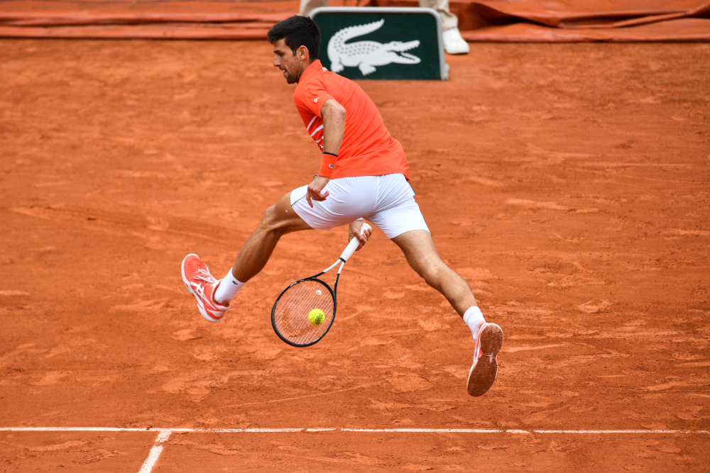 Serbiau00e2u20acu2122s Novak Djokovic returns the ball to Germanyu00e2u20acu2122s Jan-Lennard Struff during their menu00e2u20acu2122s singles fourth round match on day nine of The Roland Garros 2019 French Open tennis tournament in Paris June 3, 2019. u00e2u20acu201d AFP pic