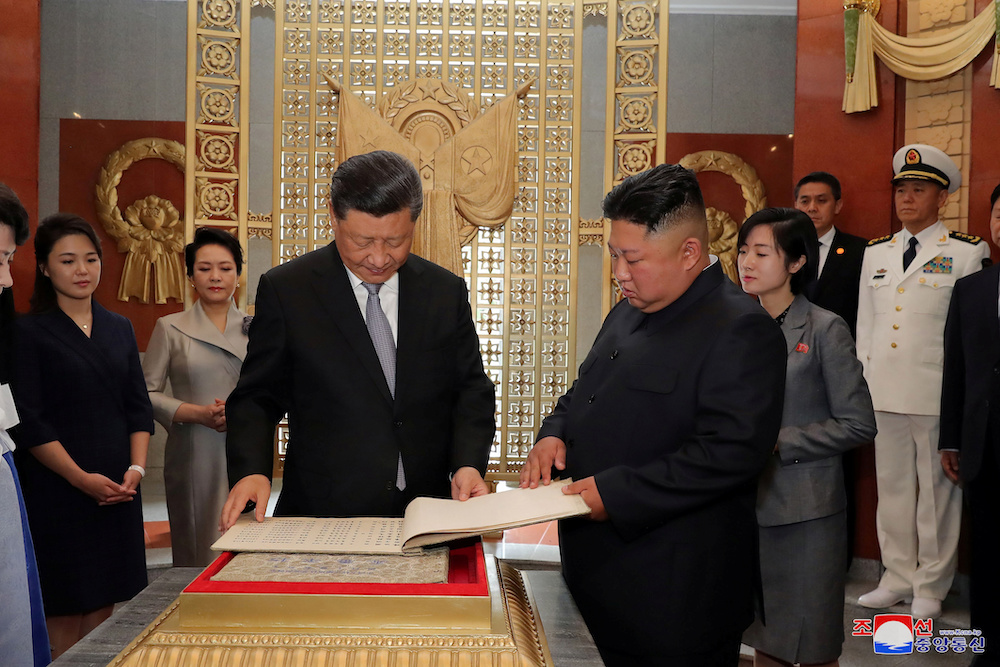 North Korean leader Kim Jong Un and Chinese President Xi Jinping look at a book during Xiu00e2u20acu2122s visit in Pyongyang, North Korea, in this picture released by North Koreau00e2u20acu2122s Korean Central News Agency on June 21, 2019. u00e2u20acu201d Reuters picnn