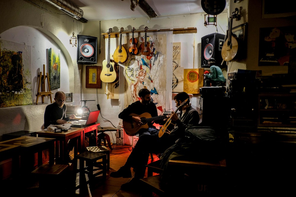 Two men play guitar during a jam session at the Tejo Bar in the Alfama neighbourhood in Lisbon May 16, 2019. u00e2u20acu201d AFP pic         