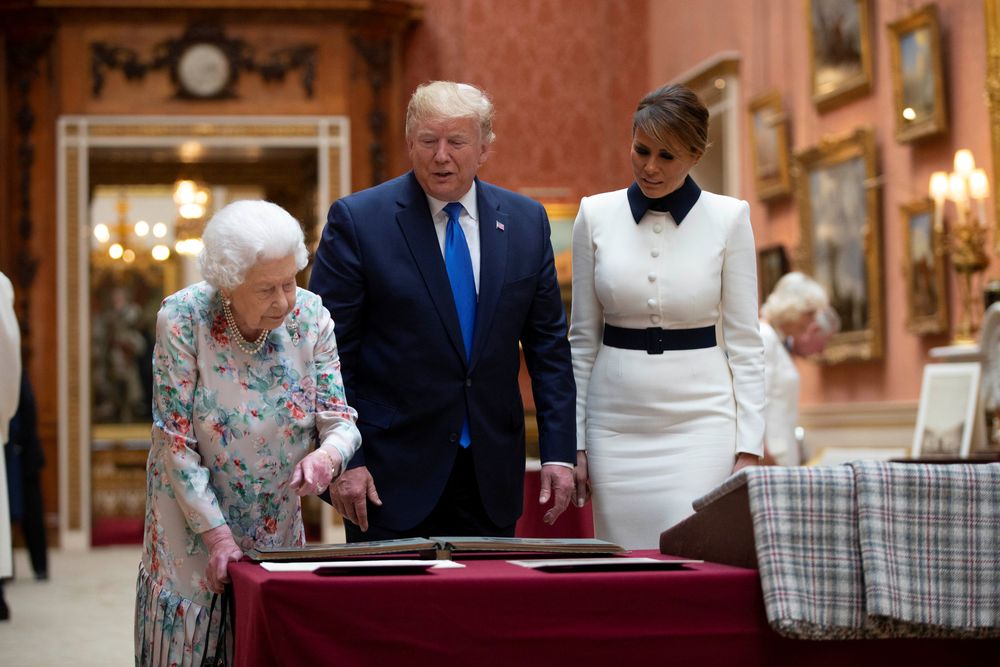 Britainu00e2u20acu2122s Queen Elizabeth II looks at a display of US items of the Royal collection with US President Donald Trump and First Lady Melania Trump at Buckingham palace in London, Britain June 3, 2019. u00e2u20acu201d Ian Vogler/Pool picture via Reuters