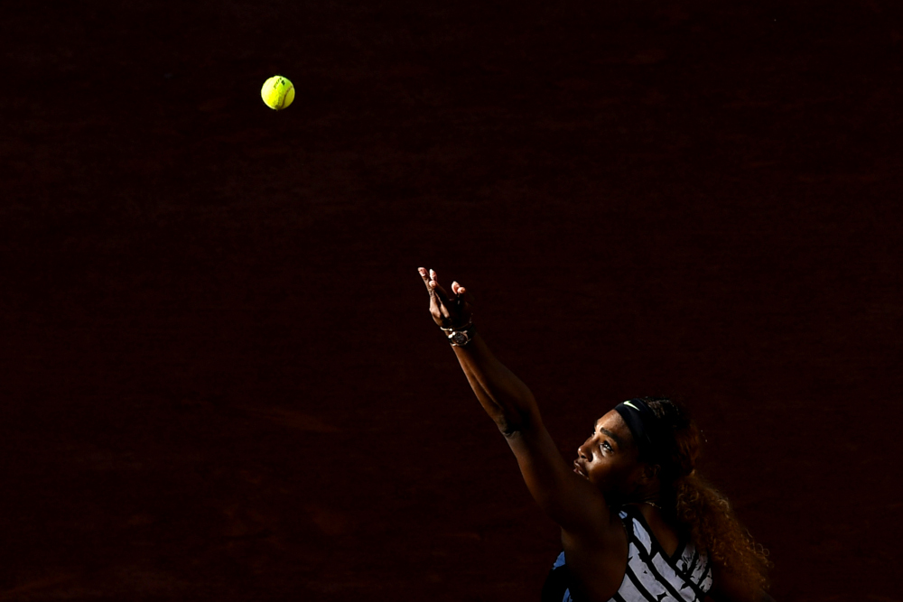 Serena Williams of the US eyes the ball as she serves the ball to Sofia Kenin of the US during their womenu00e2u20acu2122s singles third round match on day seven of The Roland Garros 2019 French Open tennis tournament in Paris June 1, 2019. u00e2u20acu201d AFP pic 
