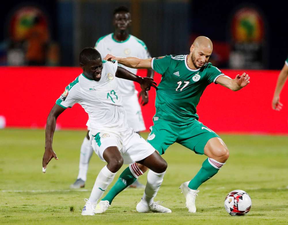 Algeria's Adlene Guedioura in action with Senegal's Alfred N'Diaye during the Africa Cup of Nations match in Cairo June 27, 2019. u00e2u20acu2022 Reuters pic