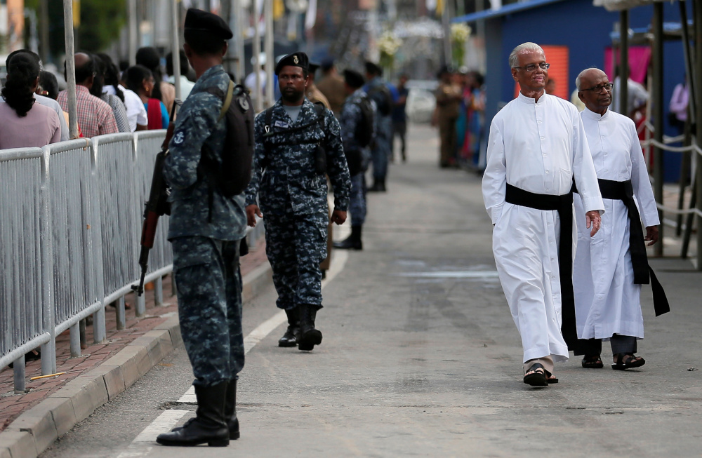 Sri Lankan military stand guard as priests arrive at the reopening ceremony of the St Anthonyu00e2u20acu2122s Shrine, one of the churches attacked in the April 21st Easter Sunday bombings in Colombo, Sri Lanka June 12, 2019. u00e2u20acu201d Reuters pic 