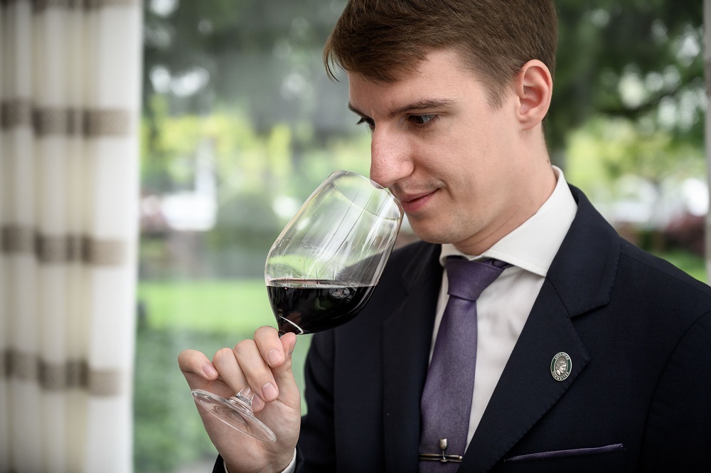 Worldu00e2u20acu2122s best sommelier, 27-year-old Marc Almert smells a glass of red wine at the two-Michelin-starred Pavillon restaurant at the Baur au Lac hotel in Zurich May 8, 2019. u00e2u20acu201d AFP pic   