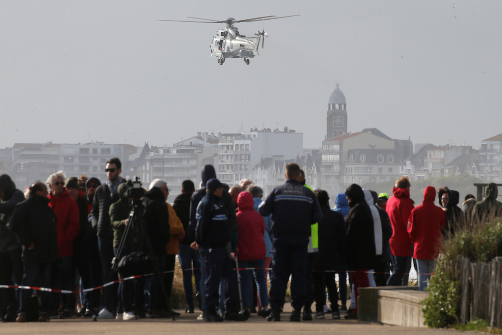 People look at rescue operations off the coast after a sea-rescue boat of the SNSM capsized during the storm Miguel, in Les Sables du00e2u20acu2122Olonne, France, June 7, 2019. u00e2u20acu201d Reuters picnn
