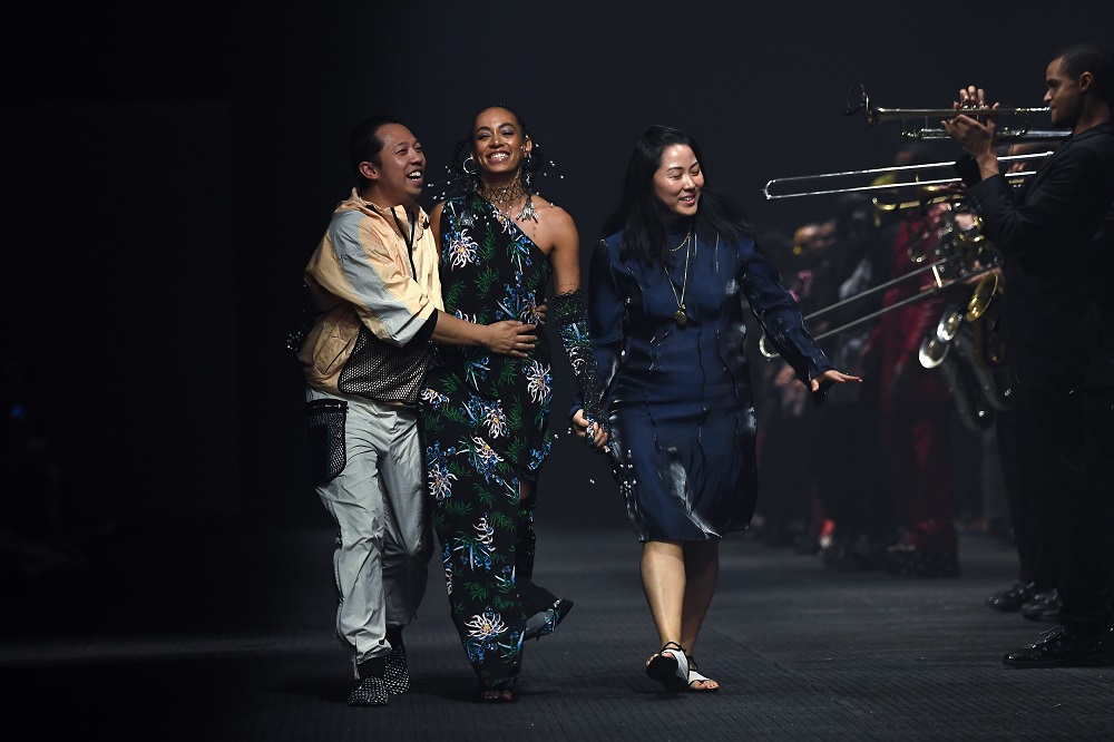 Kenzou00e2u20acu2122s designers Humberto Leon and Carol Lim, and singer Solange Knowles, acknowledge the audience at the end of presentation of Kenzou00e2u20acu2122s creations during the menu00e2u20acu2122s spring/summer 2020 fashion collection in Paris June 23, 2019. u00e2u20acu2022 AFP pic      