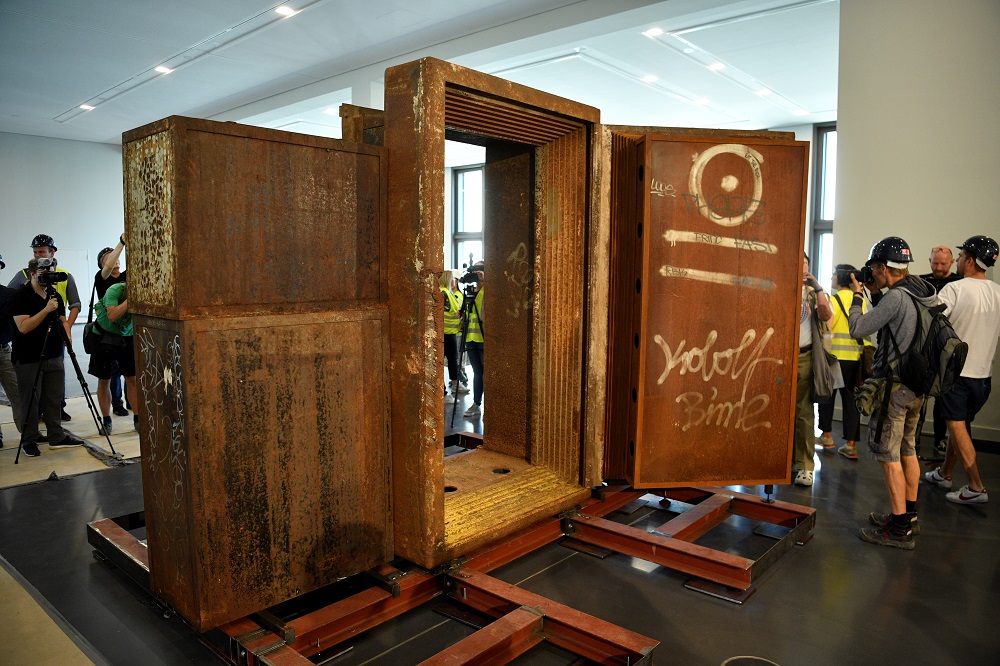 Journalists gather around the former door of Berlinu00e2u20acu2122s legendary techno club Tresor displayed at the Humboldt Forum on June 18, 2019 in Berlin after the door was brought to be part of the upcoming u00e2u20acu02dcBerlin exhibitionu00e2u20acu2122. u00e2u20acu201d AFP pic        