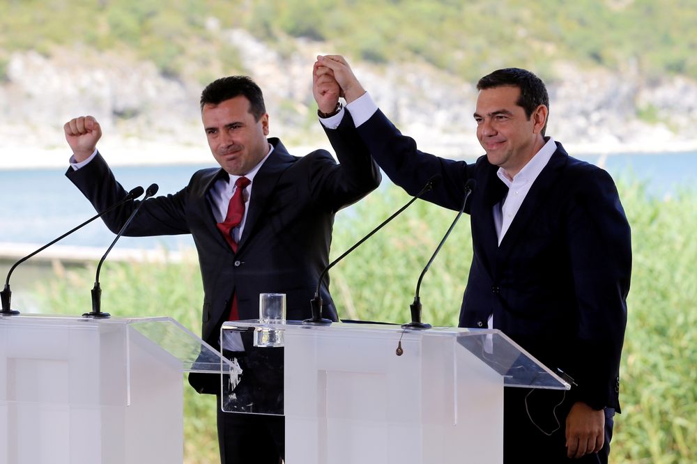 Greek Prime Minister Alexis Tsipras and Macedonian Prime Minister Zoran Zaev gesture before the signing of an accord to settle a long dispute over the former Yugoslav republic's name in the village of Psarades, Greece, June 17, 2018. u00e2u20acu201d Reuters pic