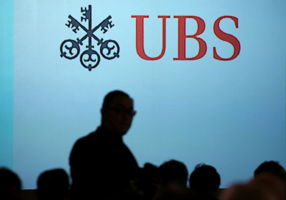 A man walks past a UBS logo projected on a screen in Singapore, January 14, 2019. u00e2u20acu201d Reuters pic