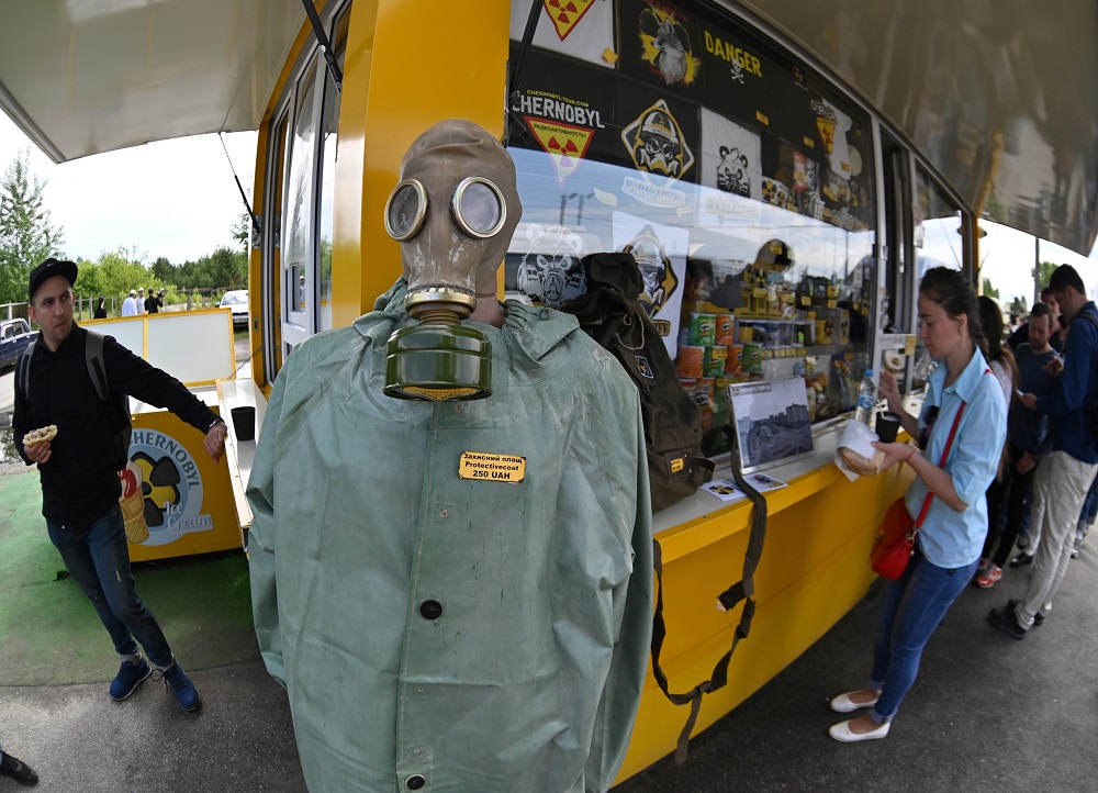 Visitors buy snacks and souvenirs at a souvenir shop next to the Dytyatky checkpoint after a tour in the Chernobyl exclusion zone, on June 7, 2019. u00e2u20acu2022 AFP pic      