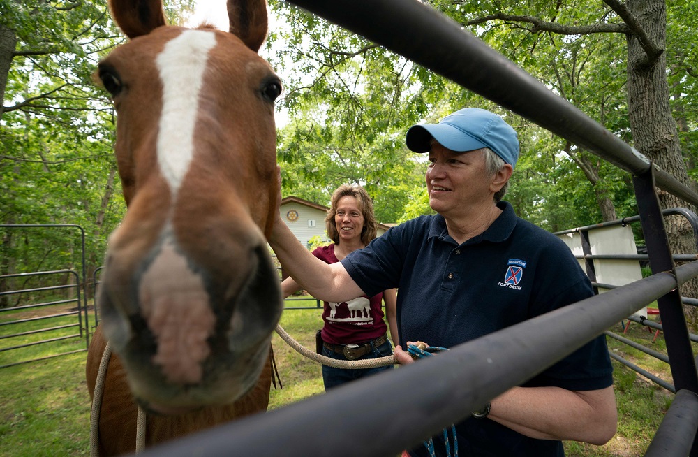 Jen Baker (right), US Army attendes the Joseph Dwyer Veterans Peer Support Project as Eileen Shanahan, founder and president of the Warrior Ranch Foundation, looks on in Centre Moriches, New York June 1, 2019. u00e2u20acu201d AFP pic         