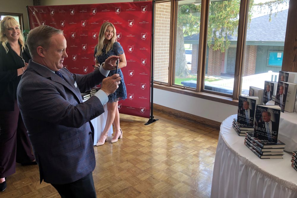 Former White House spokesman Sean Spicer takes a picture of his own book display at a Republican lunch in Marion, Ohio, US, May 16, 2019. u00e2u20acu201d Reuters pic