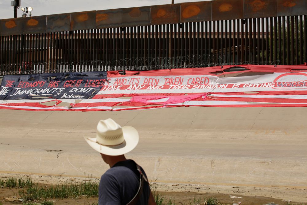 Roberto Marquez, looks on after placing a large banner in the likeness of the US flag in protest of the migration agreement between Mexico and the US, near a border wall in El Paso, as pictured from Ciudad Juarez, Mexico June 9, 2019. u00e2u20acu201d Reuters pic