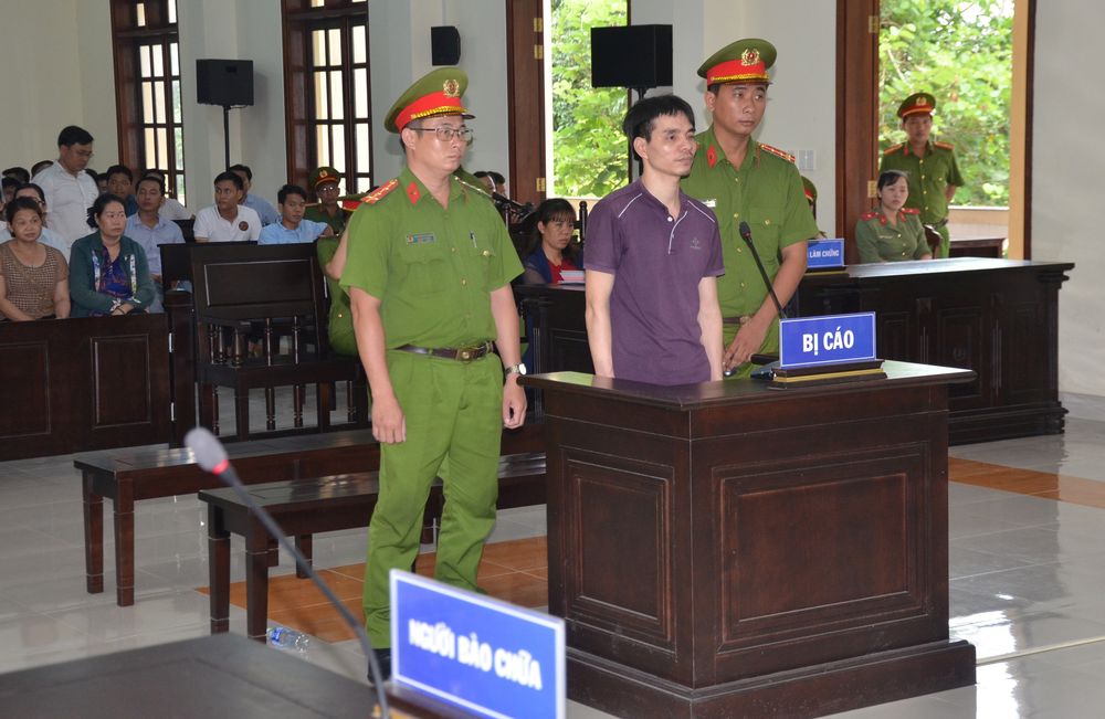 Vietnamese Facebook user Nguyen Ngoc Anh stands between policemen during his trial at a court in Ben Tre province, Vietnam June 6, 2019. u00e2u20acu201d Huynh Phuc Hau/VNA picture via Reuters