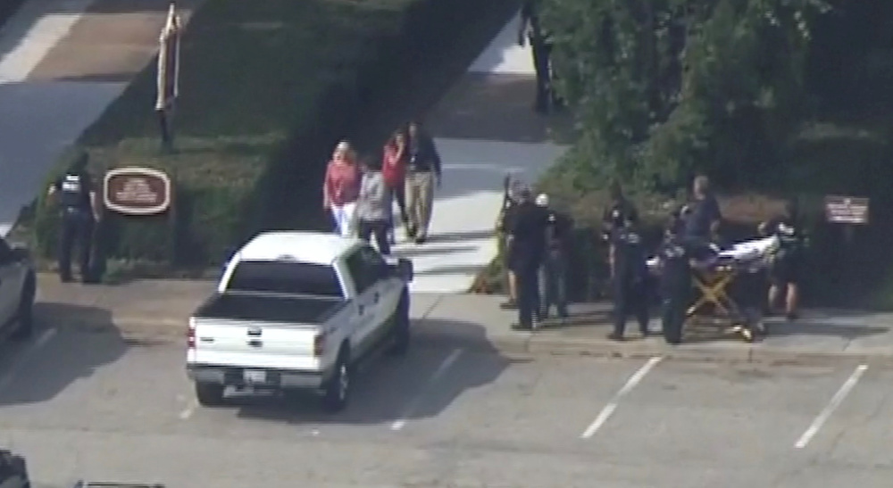 Police evacuate people from a building as a stretcher stands by in this still image taken from video following a shooting incident at the municipal centre in Virginia Beach, Virginia, US June 1, 2019. u00e2u20acu201d Reuters picnn
