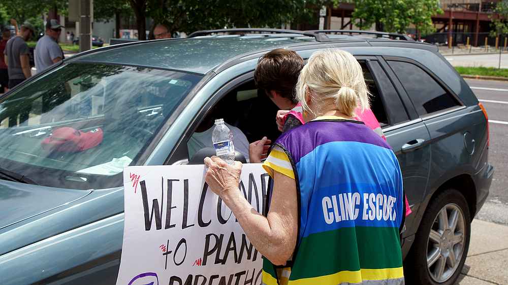A Planned Parenthood's escort advises an anti-abortion rights advocate to not stop cars coming into Planned Parenthood during a rally in St Louis, Missouri June 4, 2019. u00e2u20acu201d Reuters pic