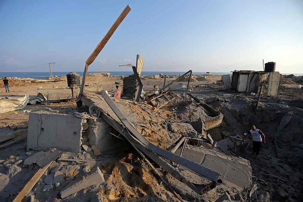 A Palestinian man inspects the site of an Israeli air strike in the southern Gaza Strip June 14, 2019. u00e2u20acu201d Reuters pic