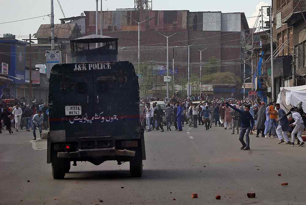 Kashmiri demonstrators throw pieces of bricks and stones towards an Indian police vehicle during a protest in Srinagar May 31, 2019. u00e2u20acu201d Reuters pic