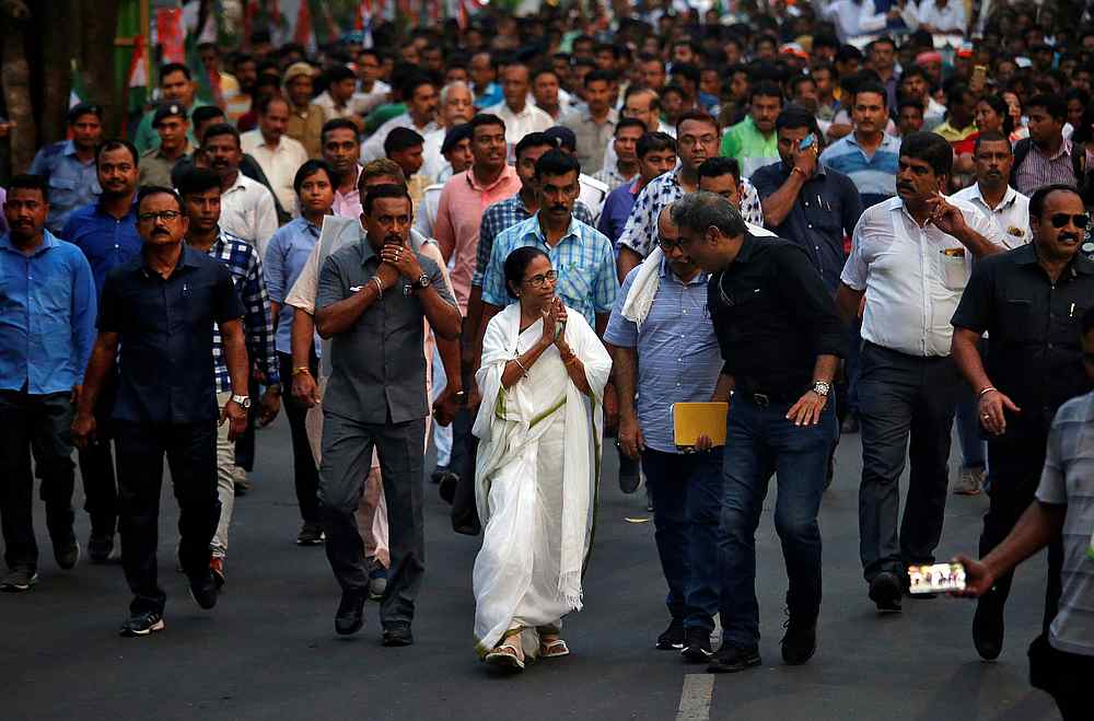 Mamata Banerjee greets her supporters as she takes part in a protest march after clashes between her Trinamool Congress party and India's ruling Bharatiya Janata Party (BJP), in Kolkata May 15, 2019. u00e2u20acu201d Reuters pic
