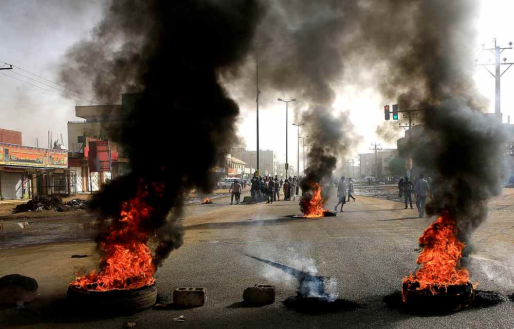 Sudanese protesters use burning tyres to erect a barricade on a street, demanding that the country's Transitional Military Council hand over power to civilians, in Khartoum June 3, 2019. u00e2u20acu201d Reuters pic