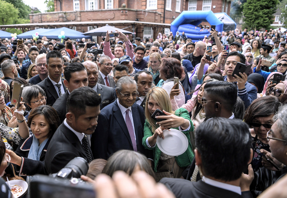 Prime Minister Tun Dr Mahathir Mohamad having a light moment with visitors during Hari Raya Eid Open House at Residence of the Malaysian High Commissioner House in London June 16, 2019. u00e2u20acu201d Bernama pic