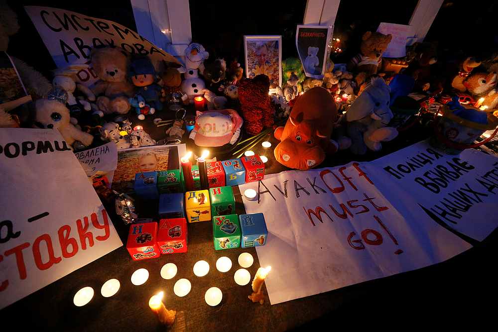 Toys and candles outside the headquarters of the Interior Ministry during a protest against the fatal shooting of five-year-old Kyrylo Tliavov by drunken police officers in Kiev, Ukraine June 4, 2019. u00e2u20acu201d Reuters pic