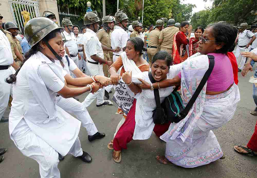 Police detain a demonstrator during a protest against the deaths of children who have died this month in Bihar, from encephalitis, commonly known as brain fever, in Kolkata, India June 24, 2019. u00e2u20acu201d Reuters pic