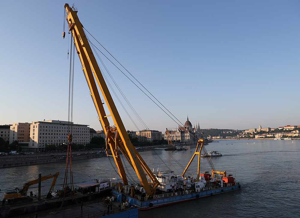 A floating crane salvages the wreck a capsized tourist boat after an accident, which killed several people in the Danube river near Margaret bridge, in Budapest, Hungary June 10, 2019. u00e2u20acu201d Reuters pic