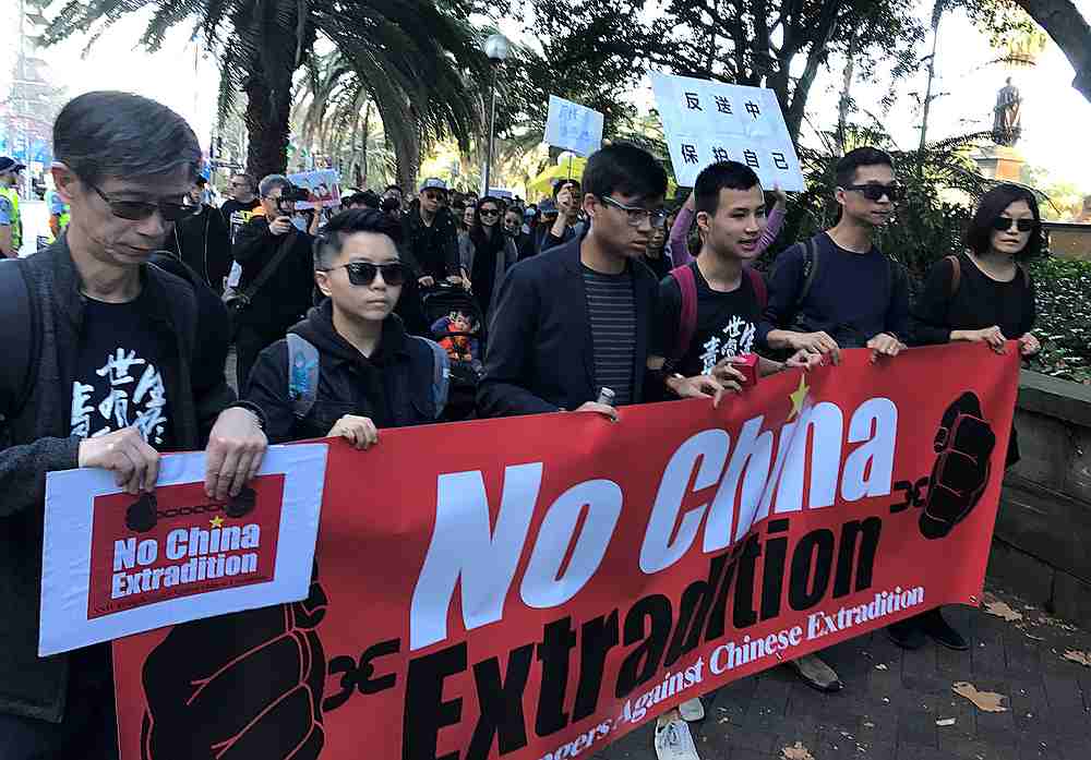 Protesters hold a banner as they walk down Elizabeth St in Sydney, Australia, during a protest against Hong Kong's proposed extradition law June 9, 2019. u00e2u20acu201d Reuters pic