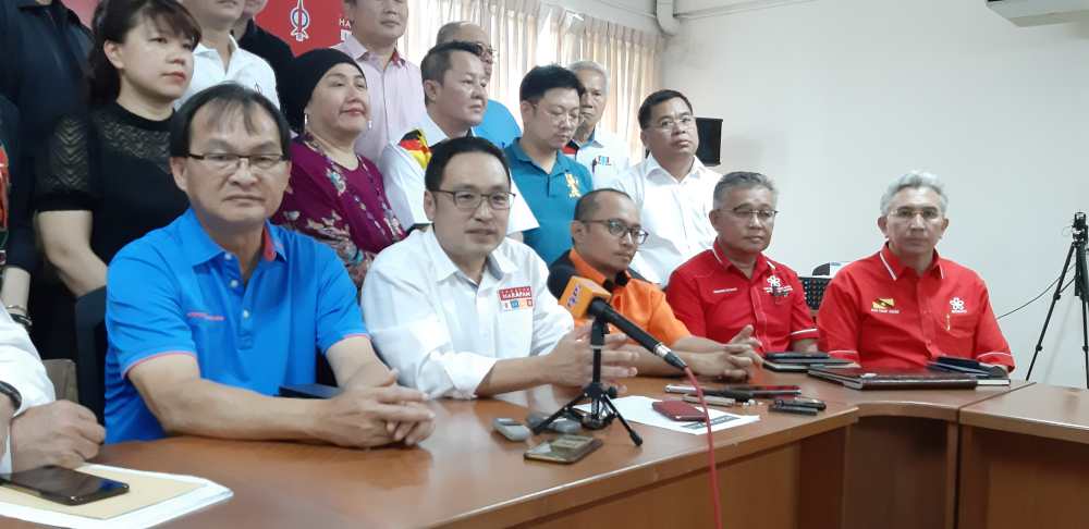 Sarawak PH chairman Chong Chieng Jen (second left), with Sarawak PKR chairman Baru Bian (left) and state Amanah chief Fidzuan Zaidi (third left), speaking to reporters after chairing the committee meeting, June 8, 2019. u00e2u20acu2022 Picture by Sulok Tawie