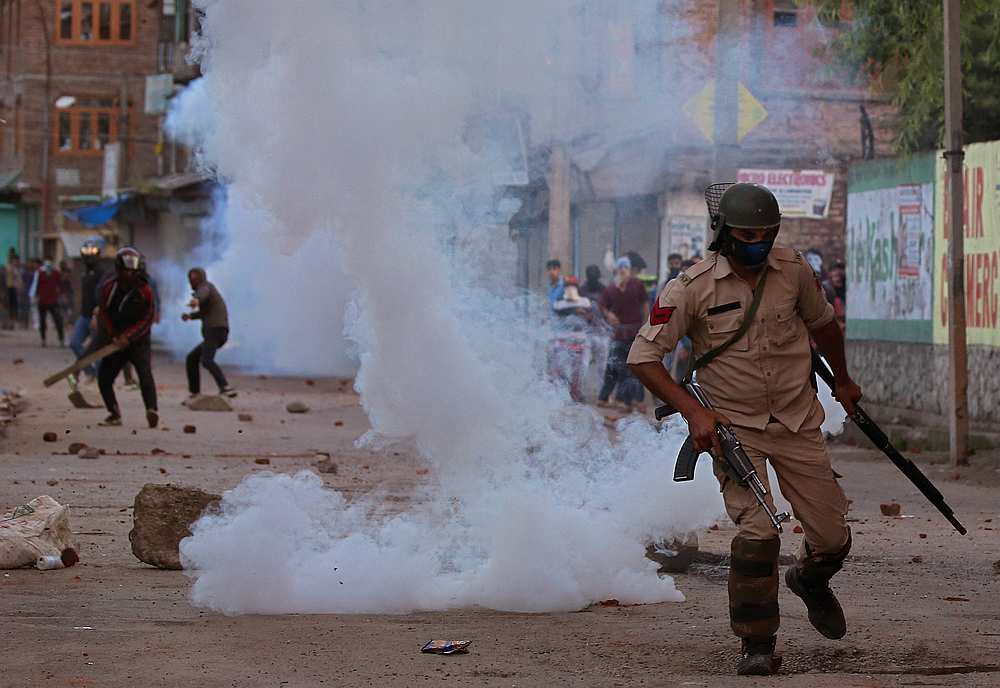 An Indian policeman runs for cover as Kashmiri protesters throws stones during a protest in Srinagar, Kashmir May 25, 2019. u00e2u20acu201d Reuters pic 