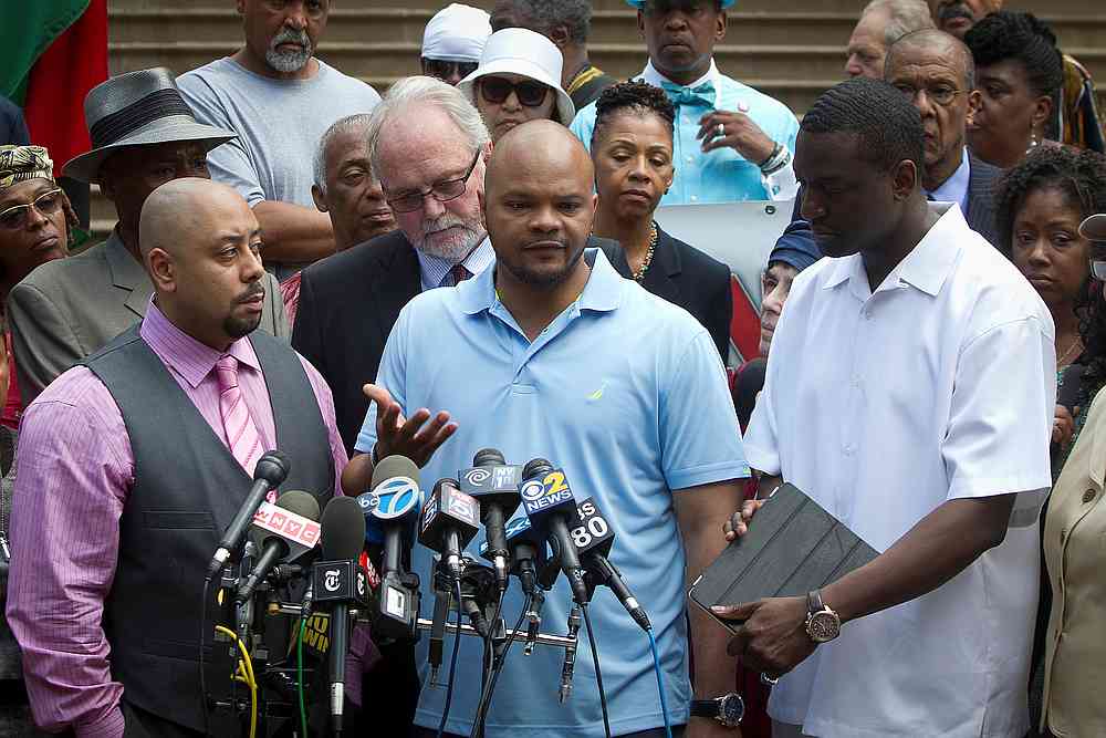'Central Park Five' members (front, from left) Raymond Santana, Kevin Richardson and Yusef Salaam at a news conference announcing the payout for the case at City Hall in New York June 27, 2014. u00e2u20acu201d  Reuters pic