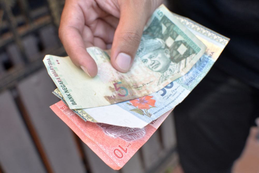 Old and damaged ringgit notes are pictured in Petaling Jaya June 8, 2019. u00e2u20acu2022 Picture by Miera Zulyana