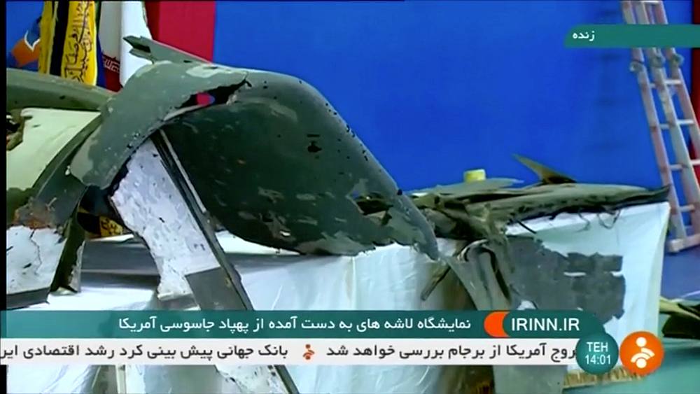 The purported retrieved sections of a downed US drone are shown on Iranian state television in an unidentified location, June 21, 2019 in this still video image. u00e2u20acu201d Irinn/Reuters TV image