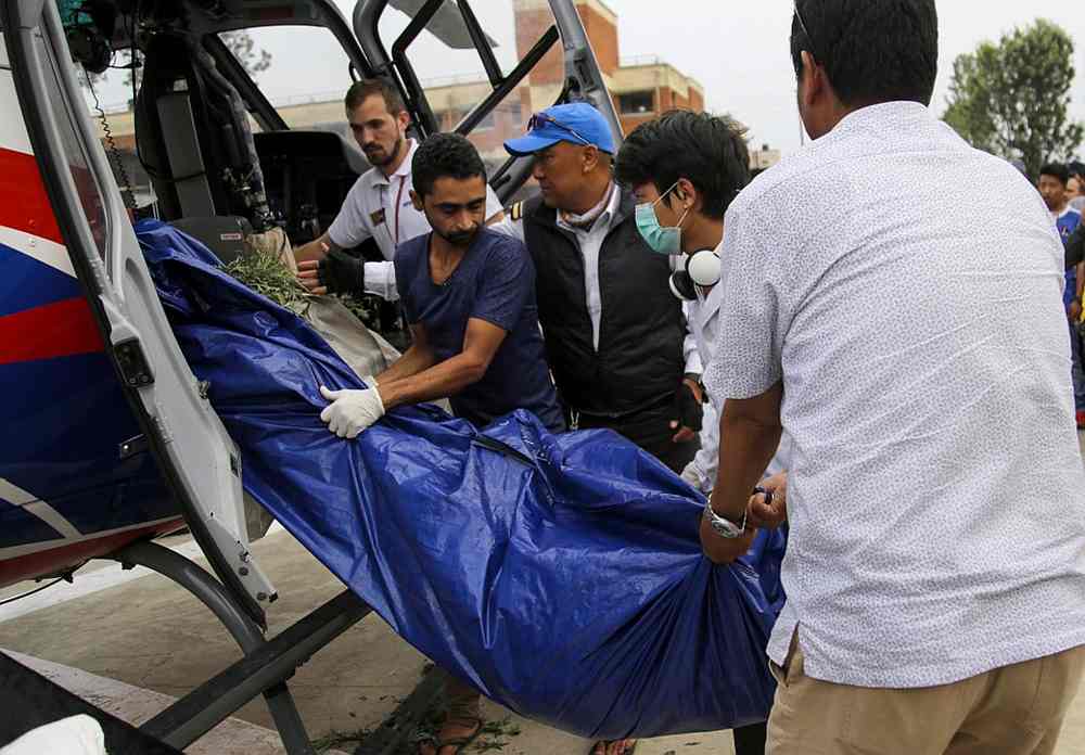 Nepali officials unload bodies of Everest climbers who died in previous seasons, at the helipad of Teaching Hospital in Kathmandu May 23, 2019. u00e2u20acu201d AFP pic