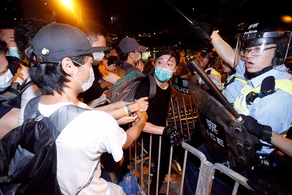 Demonstrators clash with riot police during a protest to demand authorities scrap a proposed extradition bill with China, outside the Legislative Council in Hong Kong June 10, 2019. — Reuters pic