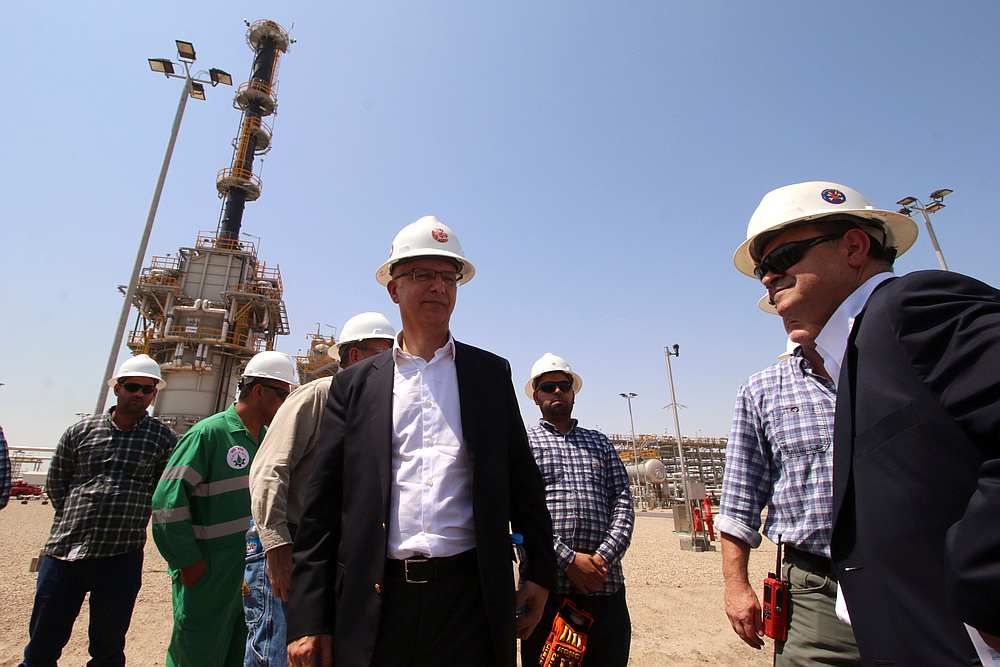 Exxon's foreign staff, Iraqi and security employees of the West Qurna-1 oilfield, which is operated by ExxonMobil, are seen during the opening ceremony near Basra, Iraq June 17, 2019. u00e2u20acu201d Reuters pic
