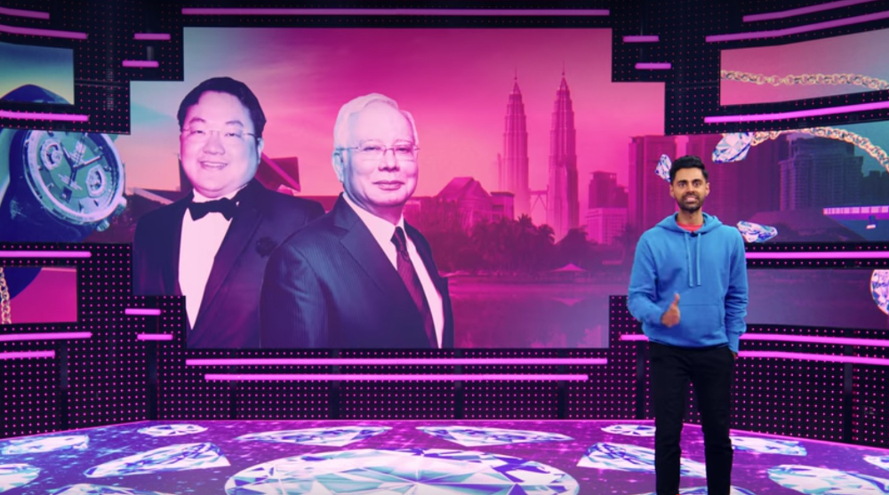 Caption: Screenshot of former PM Datuk Seri Najib Razak and Jho Low appearing on the u00e2u20acu02dcPatriot Act with Hasan Minhaju00e2u20acu2122 on Netflix as Minhaj discusses the 1MDB scandal and sovereign wealth funds.