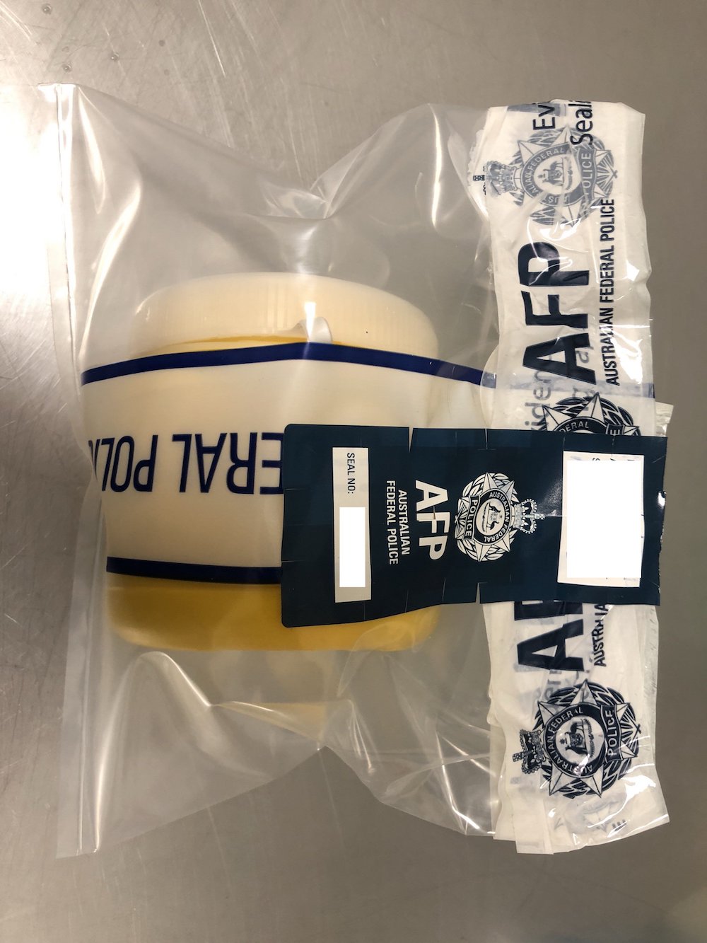 The heroin pellets in a bio-sealed evidence bag. u00e2u20acu201d Australia Federal Police pic