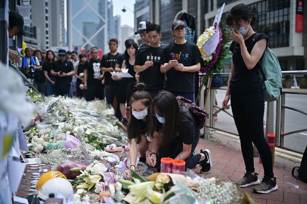 Mourners place flowers and offer prayers at the site where a protester died, prior to the start of a rally in Hong Kong on June 16, 2019. Hong Kong was braced for another mass rally, as public anger seethed. u00e2u20acu201d AFP pic