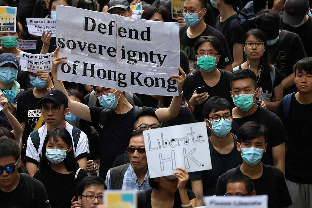Hong Kong activists march to major international consulates in an attempt to rally foreign governments' support for their fight against a controversial extradition bill, in Hong Kong June 26, 2019. u00e2u20acu201d Reuters pic