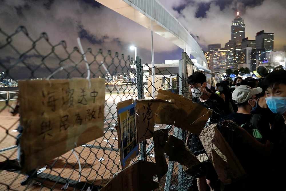 Anti-extradition bill protesters try to enter the restricted site Central waterfront site earmarked for People's Liberation Army dock, in Hong Kong June 28, 2019. u00e2u20acu201d Reuters pic