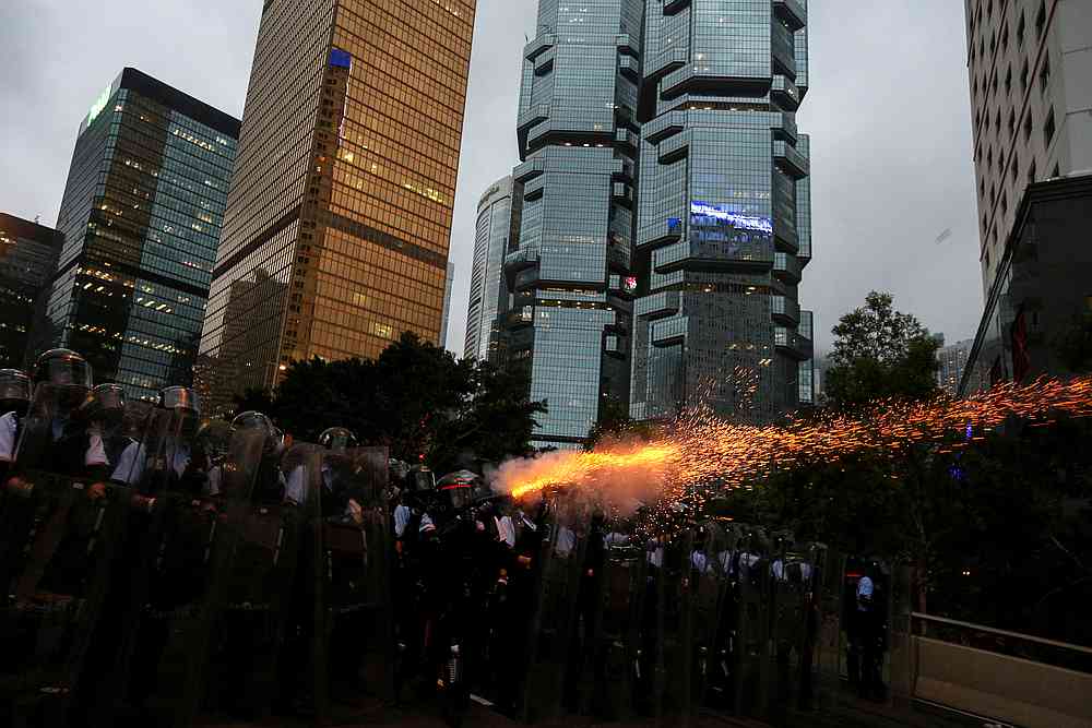 Police officers fire tear gas during a demonstration against a proposed extradition bill in Hong Kong June 12, 2019. u00e2u20acu201d Reuters pic
