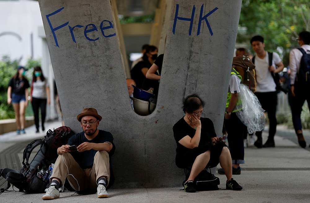 People attend a protest following a day of violence over a proposed extradition bill, under a footbridge leading to the Legislative Council building in Hong Kong June 13, 2019. u00e2u20acu201d Reuters pic